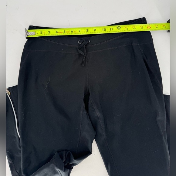 Nike Women's Dri-FIT Unlimited Zippered Cuff Versatile Pants - Picture 9 of 16